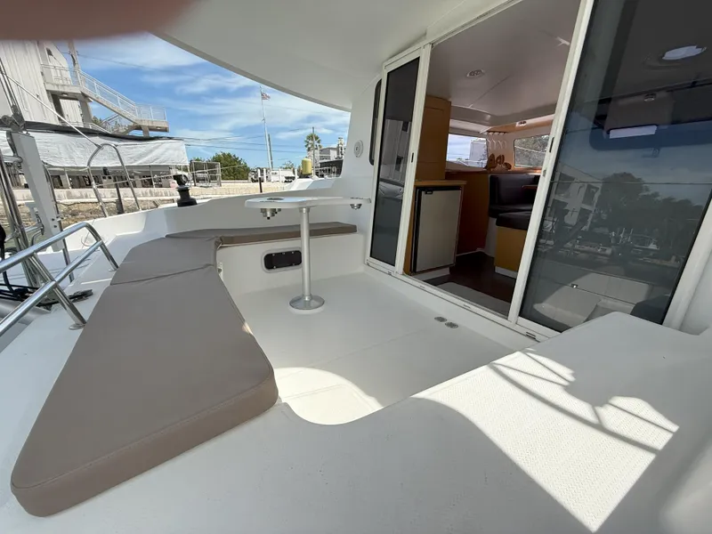 Slide: The Image of 2014 Fountaine Pajot Mahe 36 Evolution yacht with spacious outdoor seating and interior view. - 26