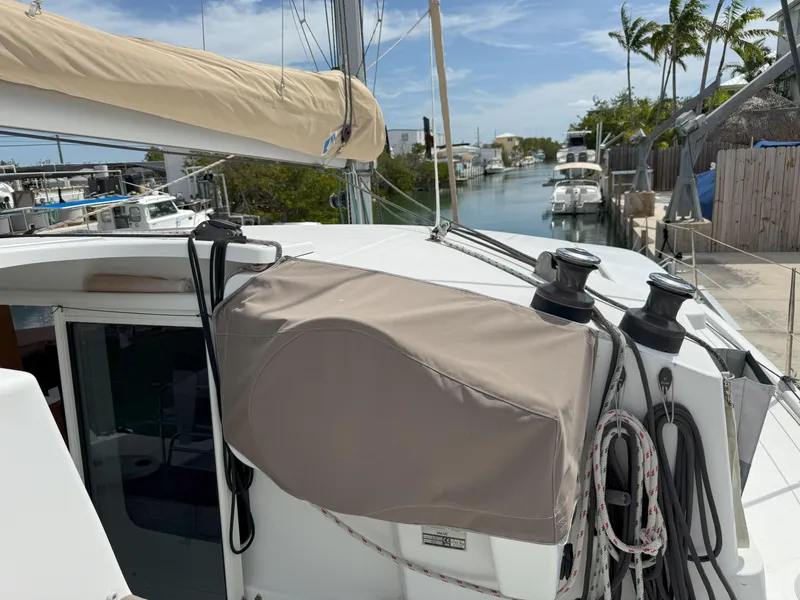 Slide: The Image of 2014 Fountaine Pajot Mahe 36 Evolution sailboat docked near a canal. - 36