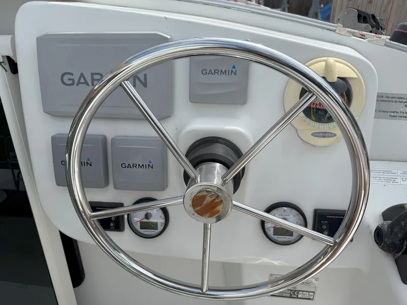 Slide: The Image of Steering wheel and Garmin controls on 2014 Fountaine Pajot Mahe 36 Evolution yacht. - 37