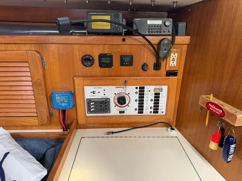 Slide: The Image of Navigation and control panel inside a 1999 Catalina 36 Mk II sailboat cabin. - 32