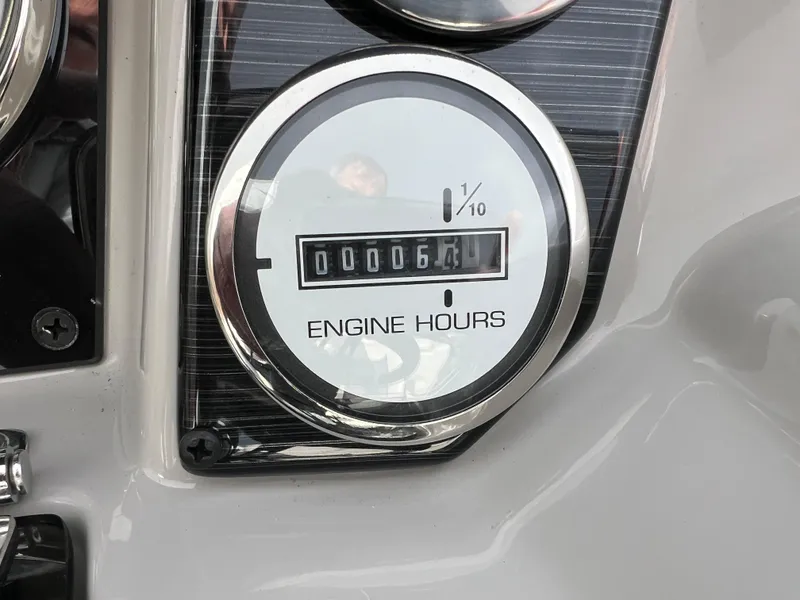 Slide: The Image of Engine hour meter showing 64 hours on 2022 Starcraft SLS 5. - 7