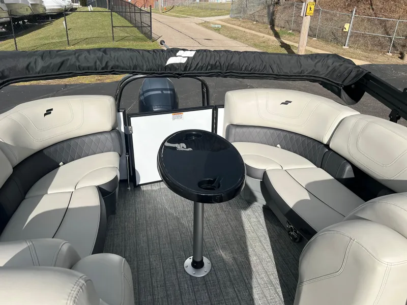 Slide: The Image of 2022 Starcraft SLS 5 boat interior with plush seating and central table. - 8