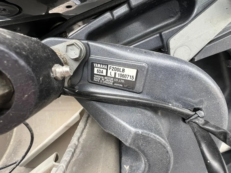 Slide: The Image of Close-up of Yamaha F200LB engine part on 2022 Starcraft SLS 5 boat. - 9