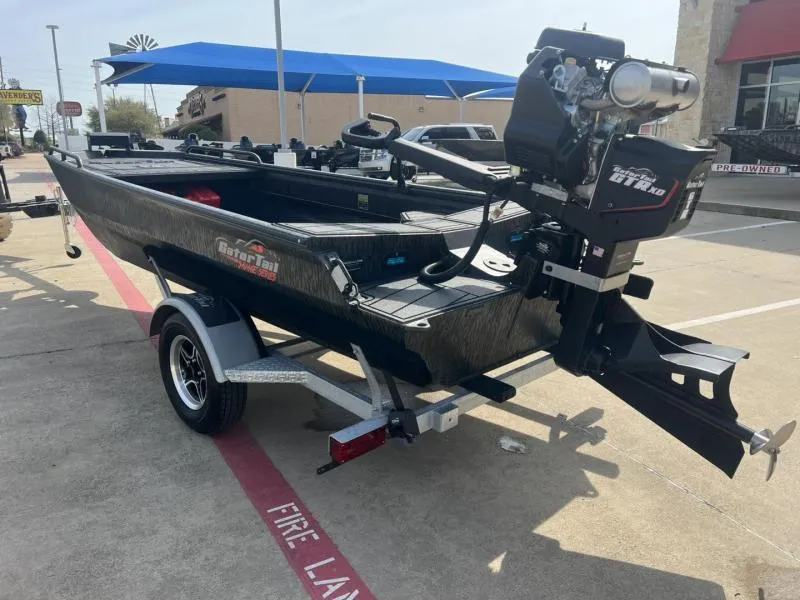 Slide: The Image of 2025 Gator Tail 17/50 Savage Series boat on trailer, outdoor display. - 3