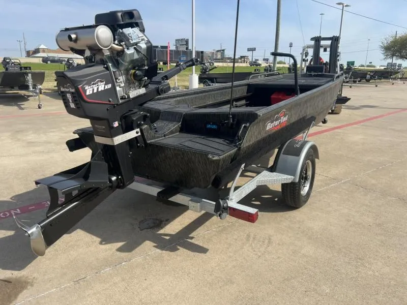 Slide: The Image of 2025 Gator Tail 17/50 Savage Series boat on trailer, featuring powerful motor. - 5