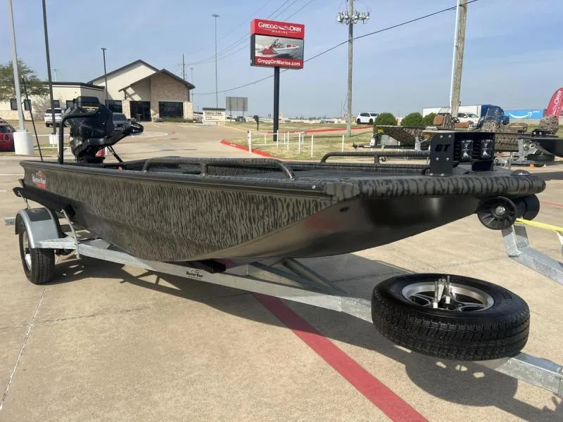 Slide: The Image of 2025 Gator Tail 17/50 Savage Series boat on trailer in parking lot. - 7