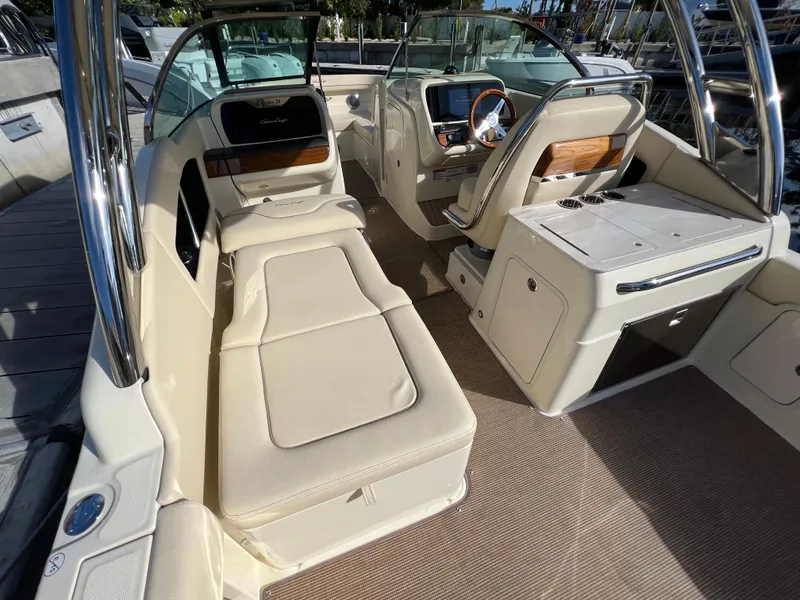 Slide: The Image of 2025 Chris-Craft Calypso 28 boat interior with luxurious seating and modern dashboard. - 12