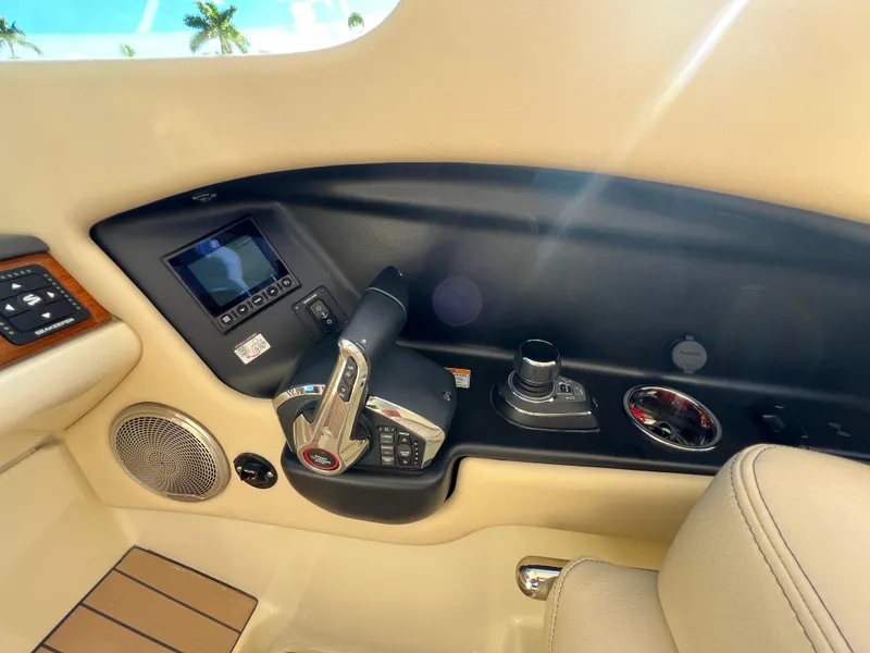 Slide: The Image of 2025 Chris-Craft Calypso 28 helm controls with modern dashboard and luxurious interior. - 15