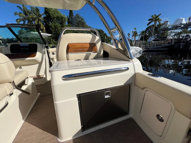 Slide: The Image of 2025 Chris-Craft Calypso 28 boat interior with luxurious seating and sleek design. - 17