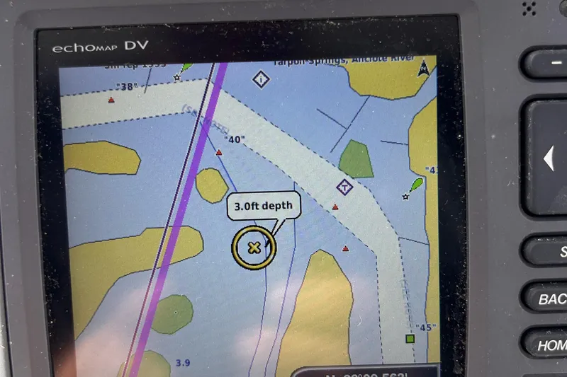 Slide: The Image of Clearwater 2300 WA 2006 boat GPS display showing 3.0 ft depth on echomap DV. - 13