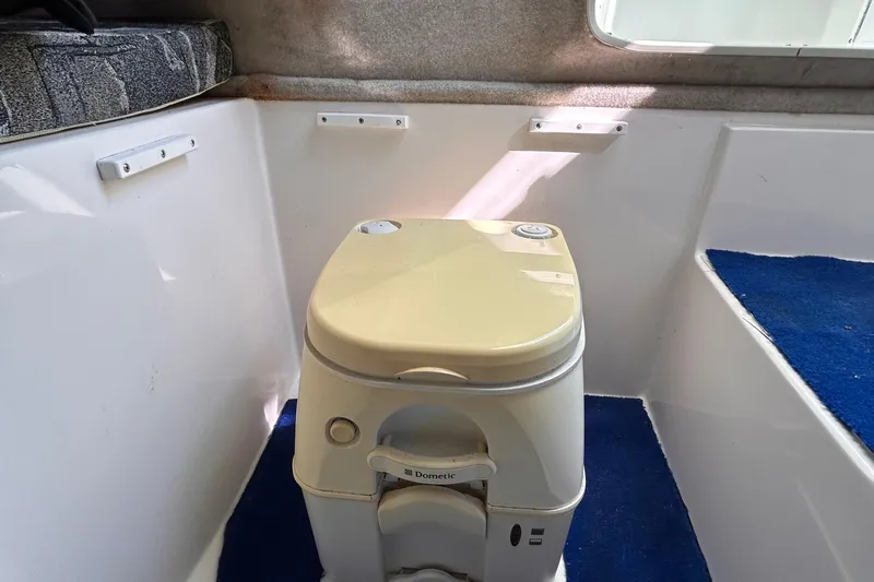 Slide: The Image of Portable toilet inside 2006 Clearwater 2300 WA boat cabin. - 19