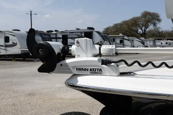Slide: The Image of Minn Kota Terrova motor on 2020 Blue Wave Pure Bay boat, parked near RVs. - 15