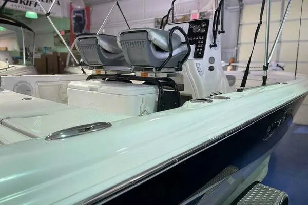 Slide: The Image of 2020 Blue Wave Pure Bay boat interior with dual seats and control panel. - 18