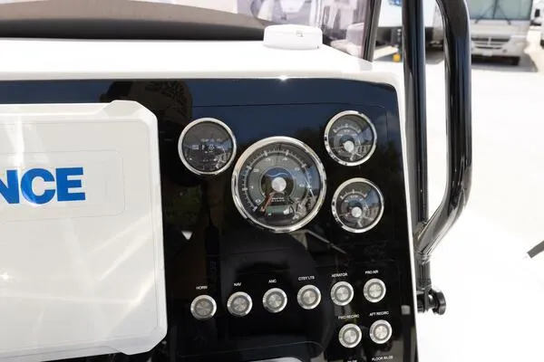 Slide: The Image of Dashboard of a 2020 Blue Wave Pure Bay boat with gauges and controls. - 22