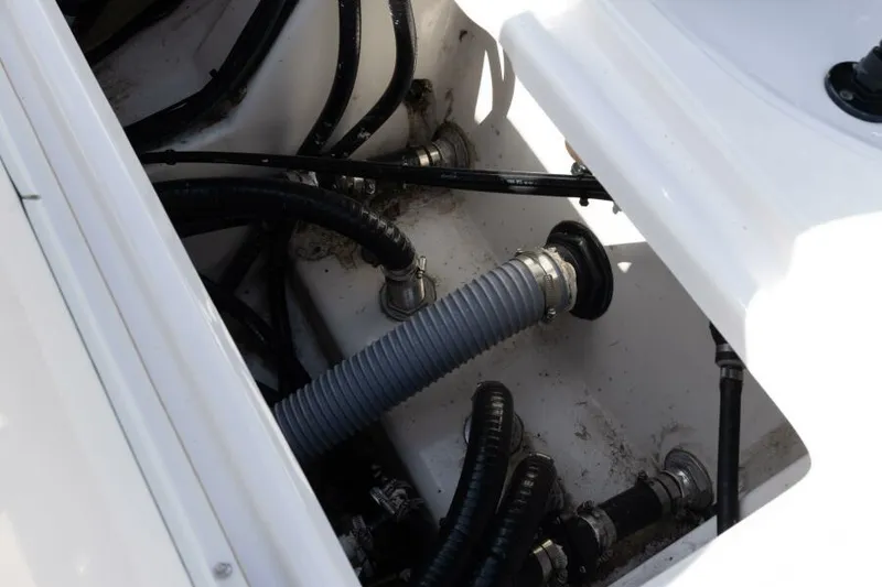 Slide: The Image of 2020 Blue Wave Pure Bay boat interior showing hoses and fittings. - 23