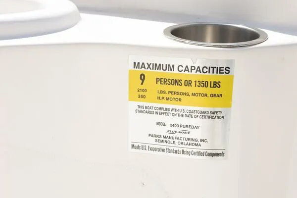 Slide: The Image of 2020 Blue Wave Pure Bay capacity label, maximum 9 persons or 1350 lbs, safety compliance details. - 25
