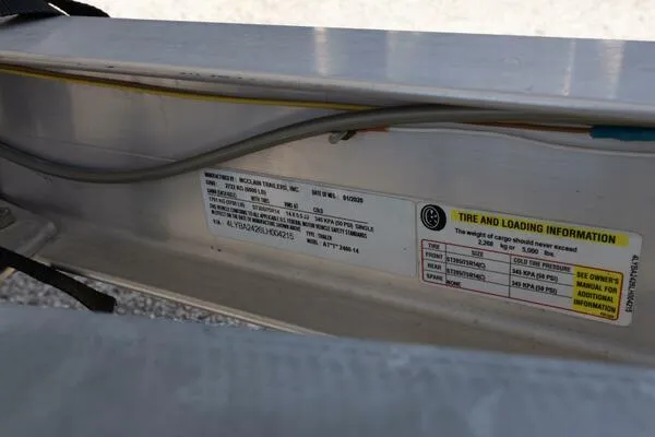Slide: The Image of 2020 Blue Wave Pure Bay trailer label with tire and loading information. - 27