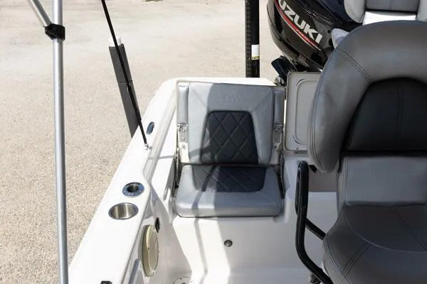 Slide: The Image of 2020 Blue Wave Pure Bay boat interior with gray seating and Suzuki engine. - 29