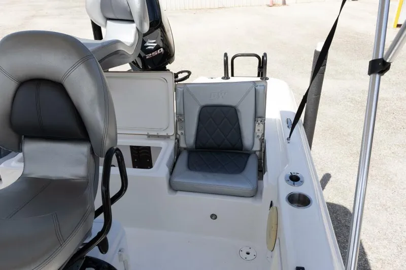 Slide: The Image of 2020 Blue Wave Pure Bay boat interior with gray seating and storage compartments. - 30