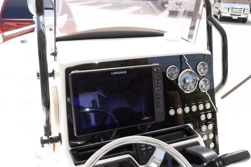 Slide: The Image of 2020 Blue Wave Pure Bay boat dashboard with Lowrance display and control panel. - 32