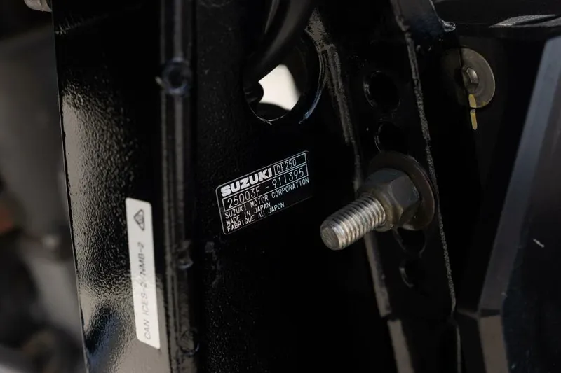 Slide: The Image of Close-up of a 2020 Blue Wave Pure Bay boat engine component with Suzuki label. - 38