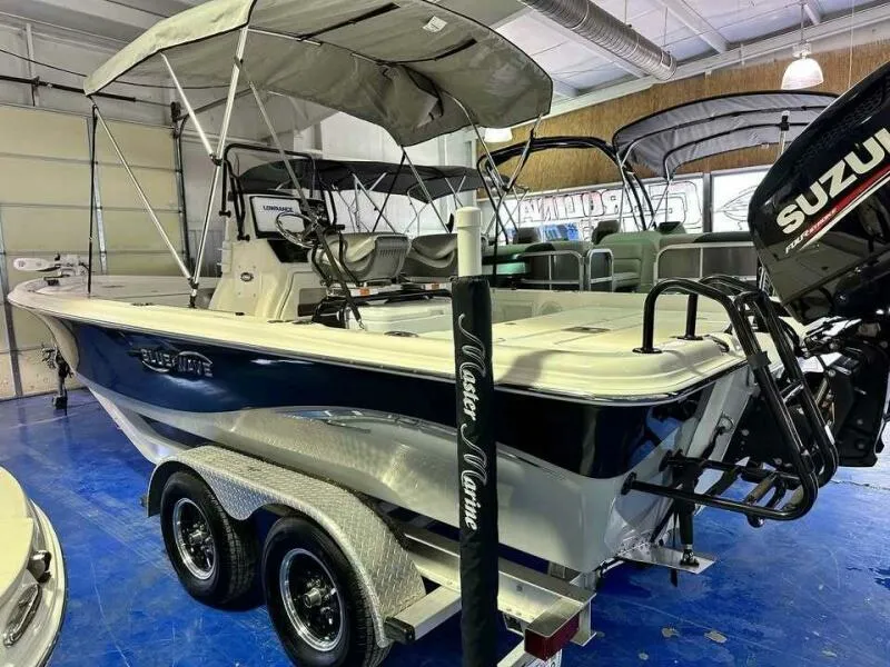 Slide: The Image of 2020 Blue Wave Pure Bay boat with Suzuki motor in showroom. - 4