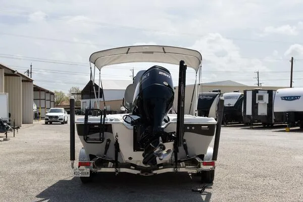 Slide: The Image of 2020 Blue Wave Pure Bay boat with outboard motor, parked in a lot. - 5