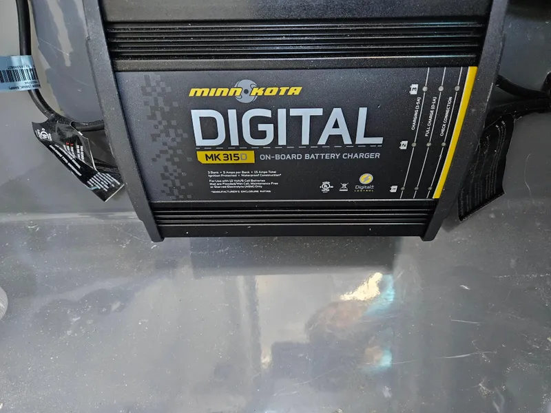 Slide: The Image of Minn Kota MK 315D digital on-board battery charger in 2021 Yamaha Boats 210 FSH Deluxe. - 23