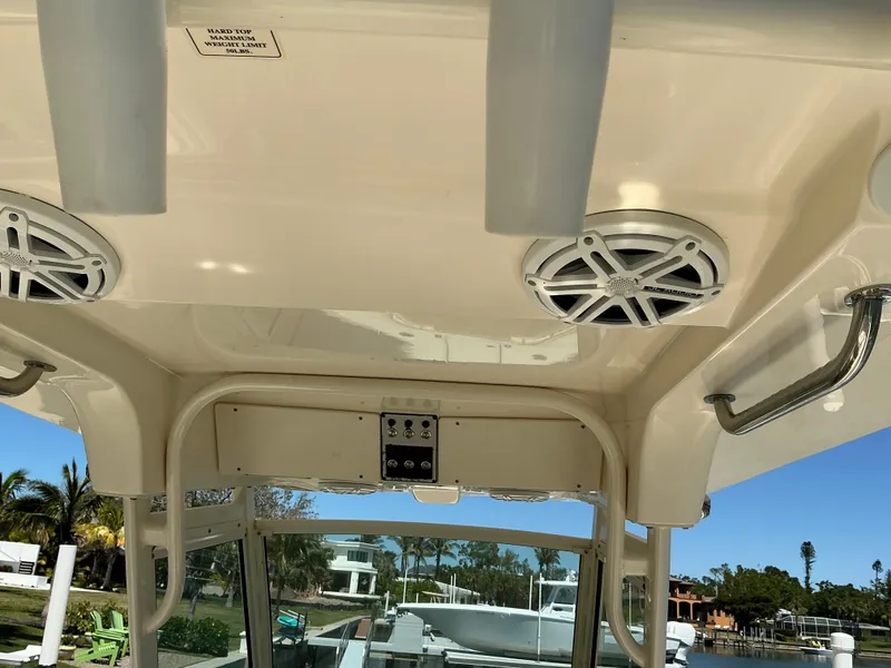 Slide: The Image of 2019 Scout 275 LXF boat interior with speakers and rod holders. - 19