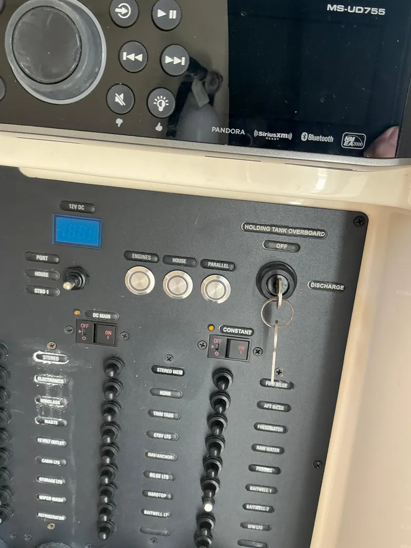 Slide: The Image of Control panel of a 2019 Scout 275 LXF boat with audio system. - 26