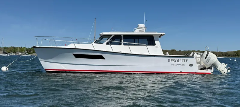 The Image of Cape Powercat 3500 PH 2020 boat on water, side view, clear sky background. - 0