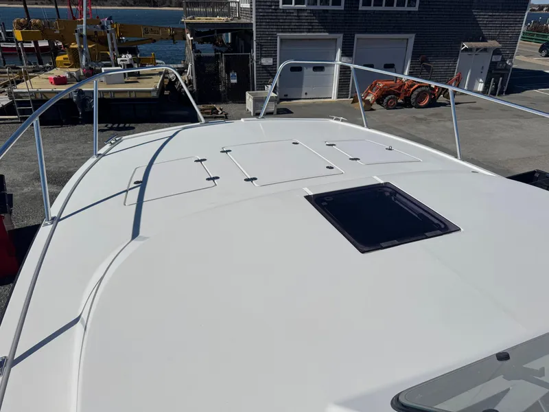 Slide: The Image of Cape Powercat 3500 PH 2020 boat deck with hatch, docked at marina. - 12
