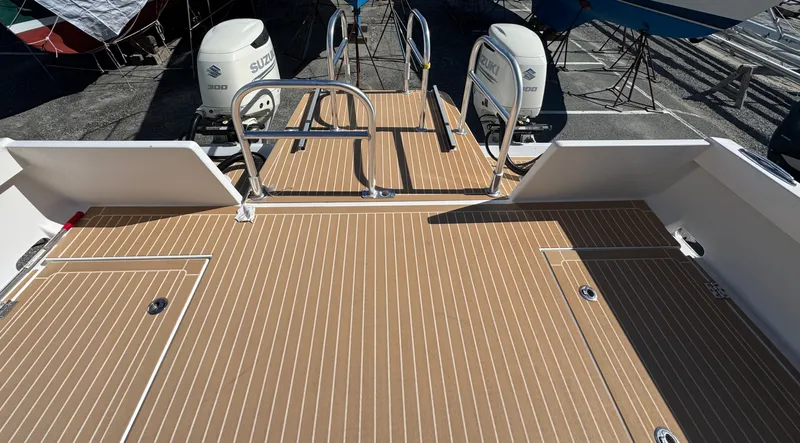 Slide: The Image of Cape Powercat 3500 PH 2020 model with dual Suzuki outboard engines and teak deck. - 13