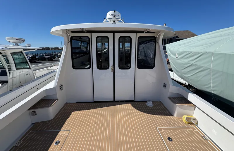 Slide: The Image of Cape Powercat 3500 PH 2020 model, rear deck view with closed cabin doors. - 16