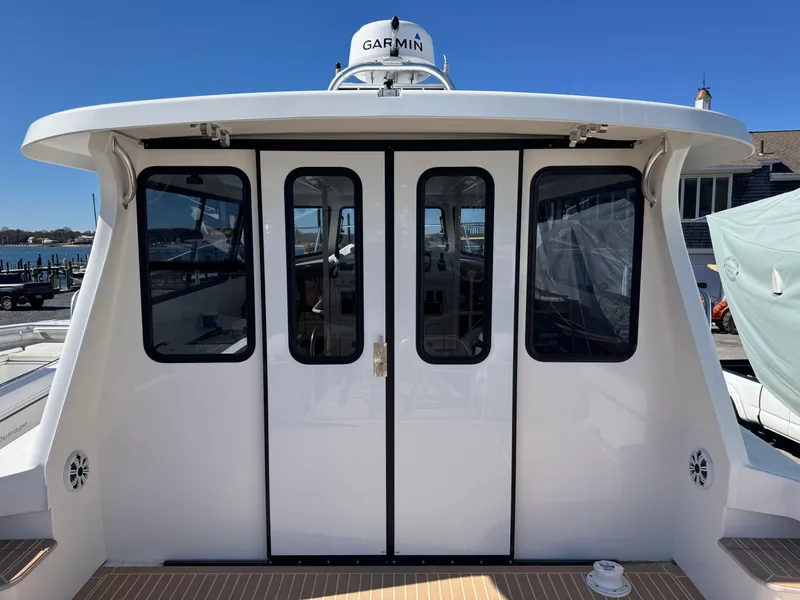 Slide: The Image of Cape Powercat 3500 PH 2020 model with Garmin equipment, docked at a marina. - 17