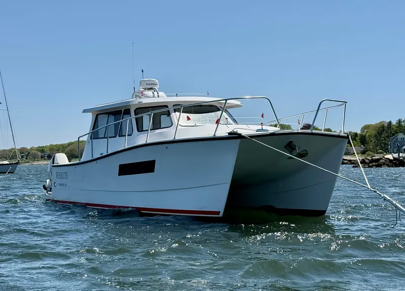 Slide: The Image of Cape Powercat 3500 PH 2020 boat on water, rear view with twin engines. - 4