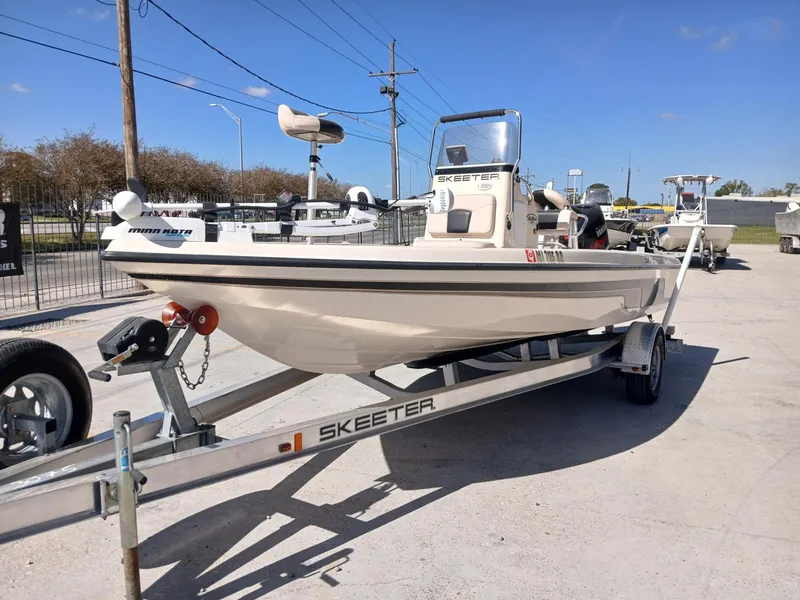 Slide: The Image of 2010 Skeeter 20 ZX boat on trailer in outdoor setting. - 13
