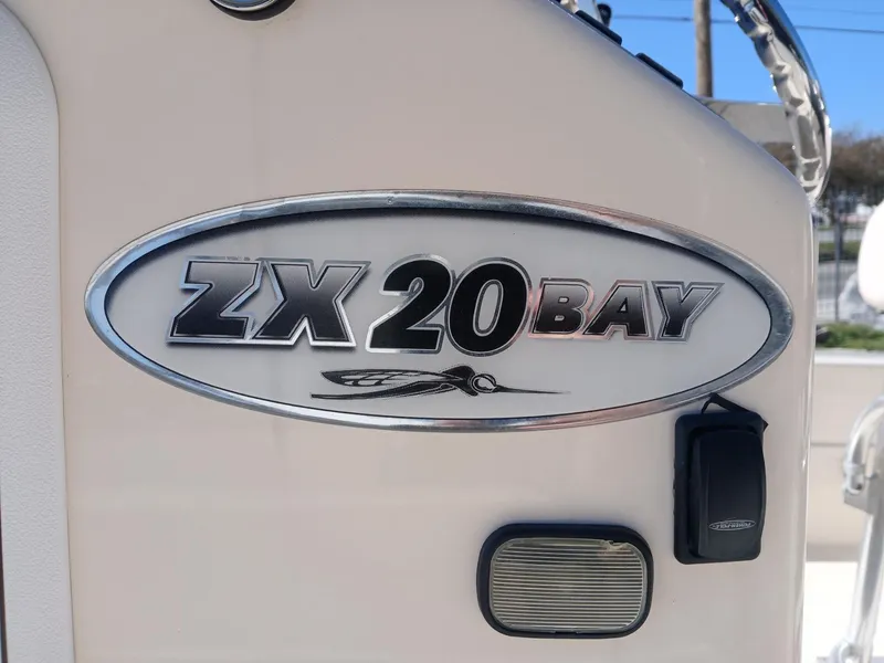 Slide: The Image of 2010 Skeeter ZX 20 Bay boat logo on white surface. - 14
