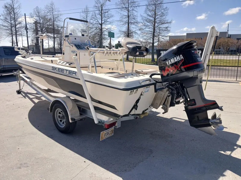 Slide: The Image of 2010 Skeeter 20 ZX boat with Yamaha outboard motor on a trailer. - 15