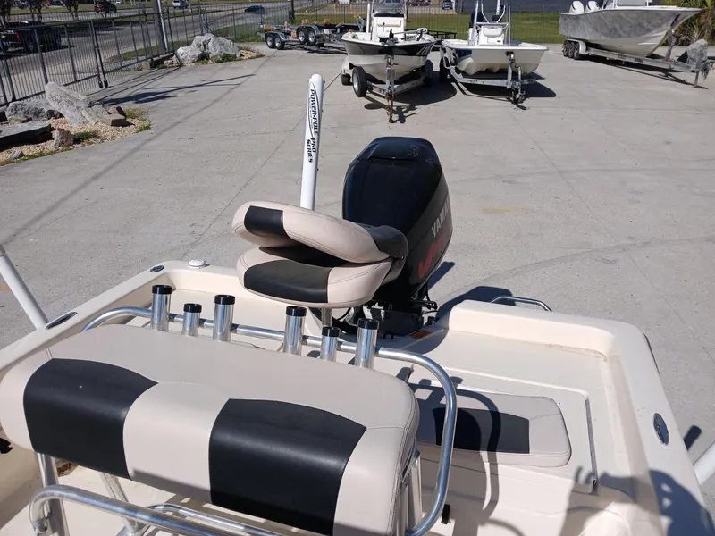 Slide: The Image of 2010 Skeeter 20 ZX boat with seating and motor, parked on concrete lot. - 5