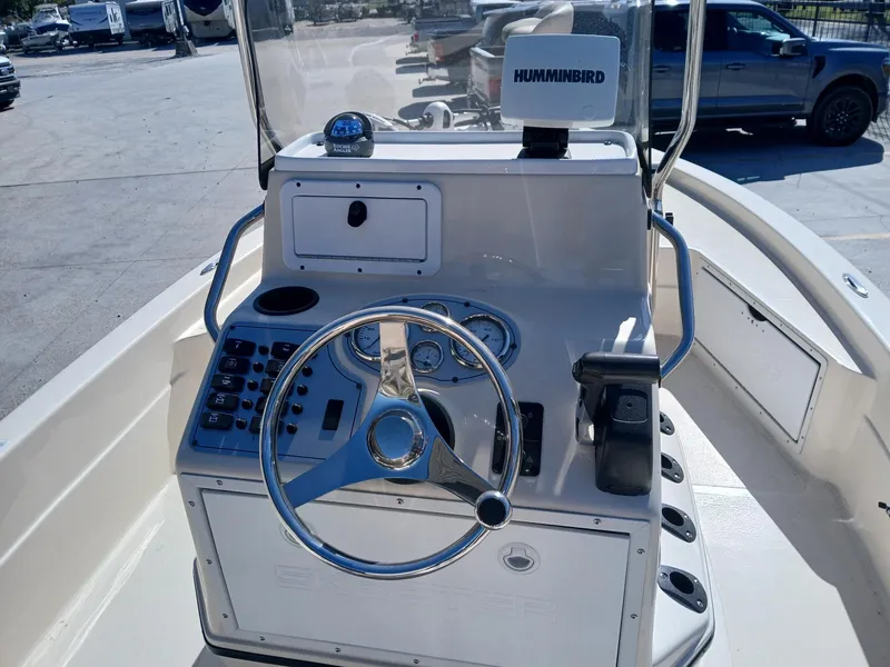 Slide: The Image of 2010 Skeeter 20 ZX boat console with steering wheel and Humminbird electronics. - 7