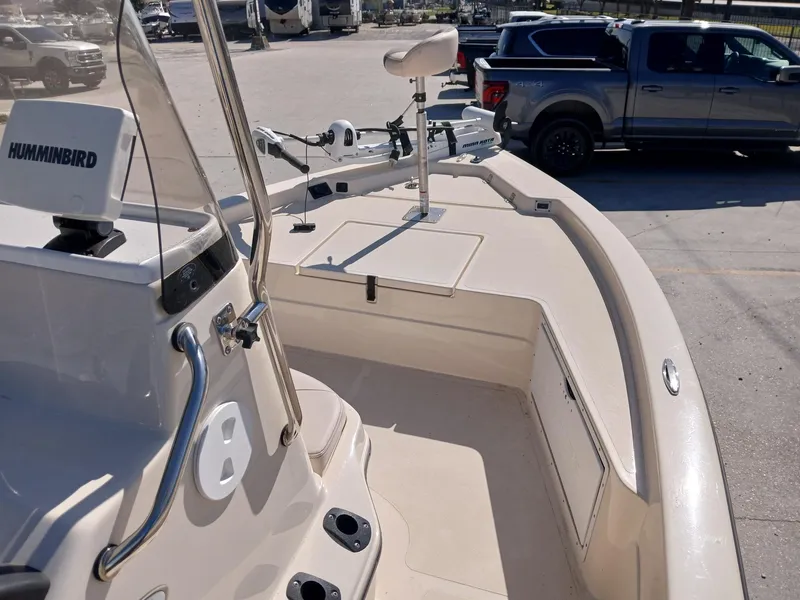 Slide: The Image of 2010 Skeeter 20 ZX boat with Humminbird electronics, parked near a truck. - 8