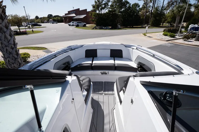 Slide: The Image of 2025 Monterey M-65 boat interior with sleek seating and modern design. - 13