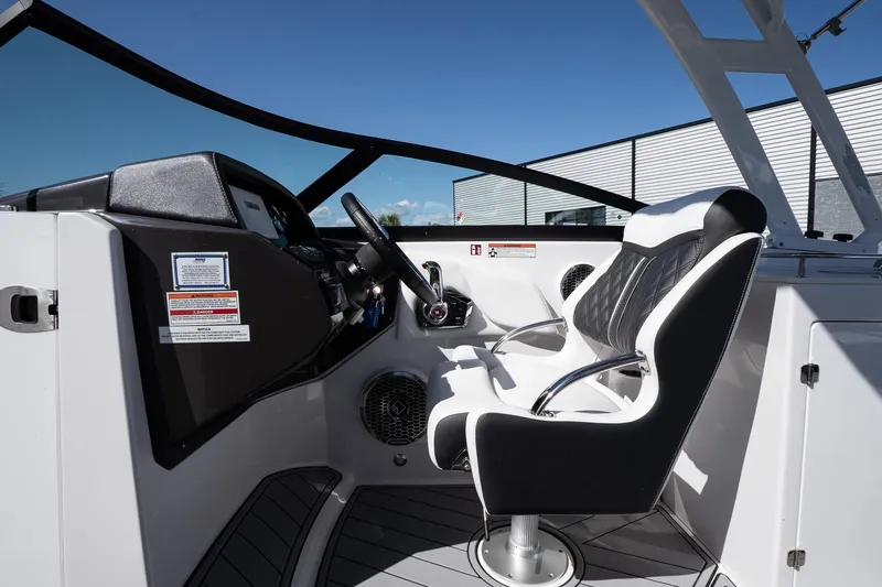Slide: The Image of 2025 Monterey M-65 boat cockpit with modern steering and seating. - 15