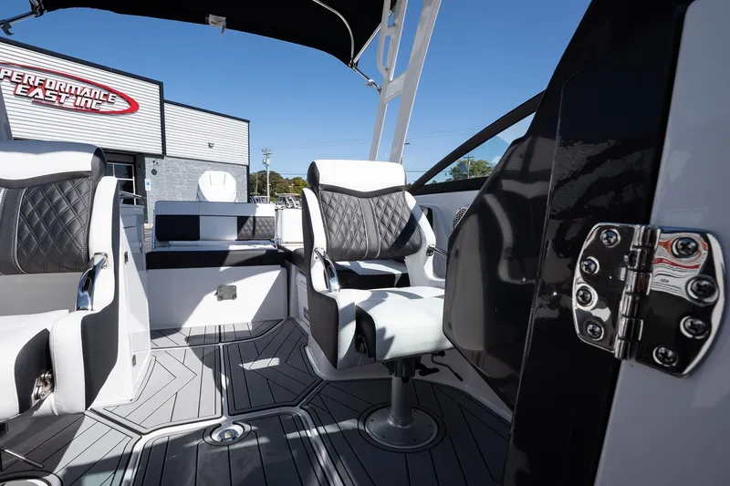Slide: The Image of 2025 Monterey M-65 boat interior with modern seating and sleek design. - 16