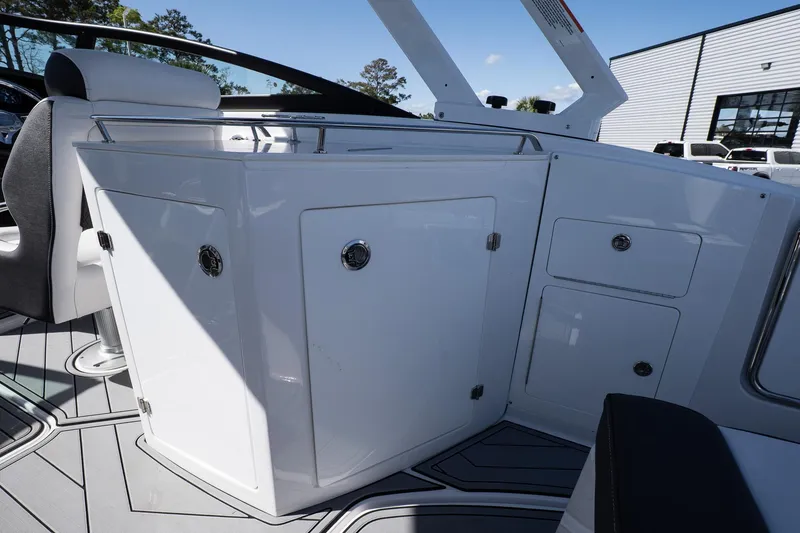 Slide: The Image of 2025 Monterey M-65 boat interior with sleek white cabinetry and modern design. - 21