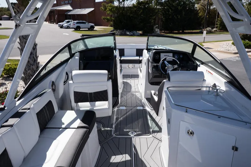Slide: The Image of 2025 Monterey M-65 boat interior with sleek seating and modern dashboard design. - 26