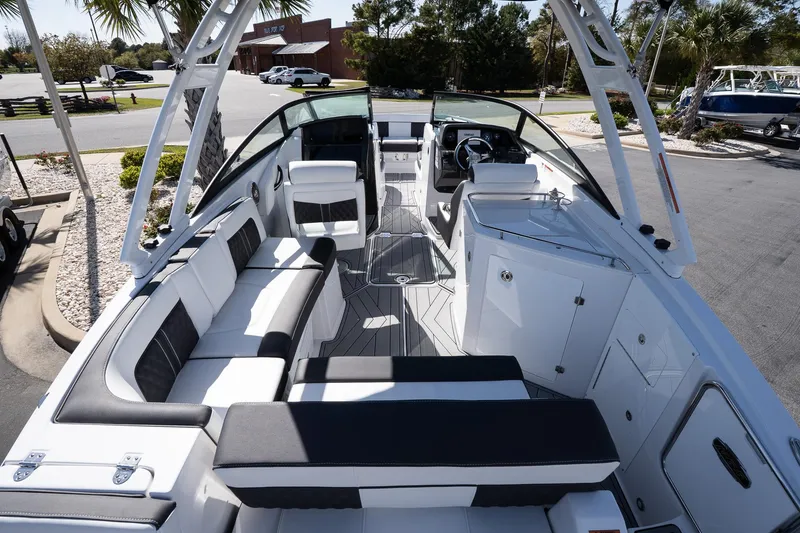Slide: The Image of 2025 Monterey M-65 boat interior with sleek seating and modern design. - 27