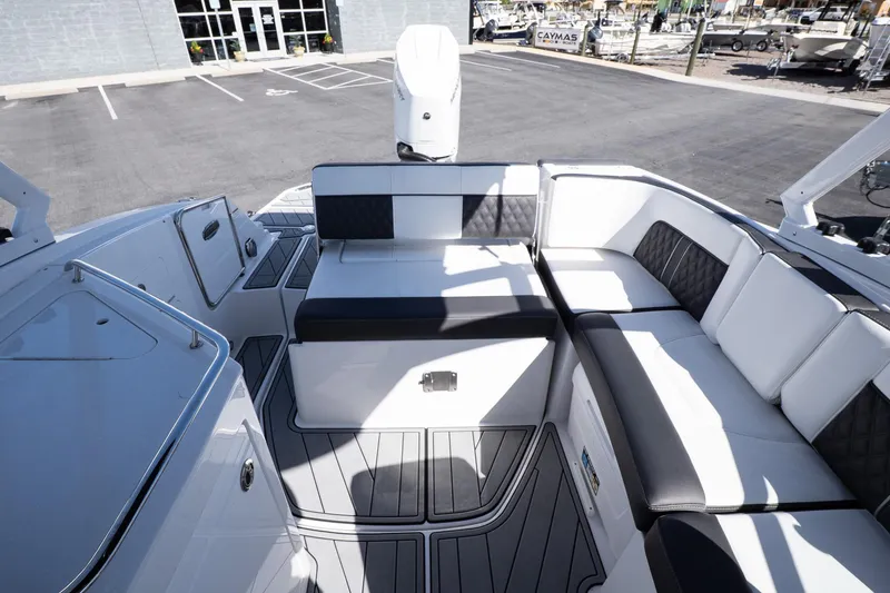 Slide: The Image of 2025 Monterey M-65 boat interior with sleek seating and modern design. - 30