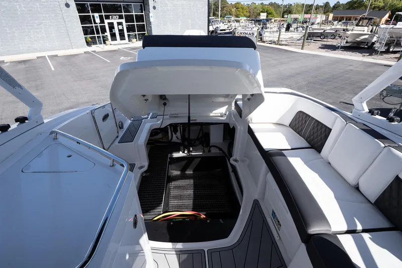 Slide: The Image of Open engine compartment of 2025 Monterey M-65 boat with seating area. - 31